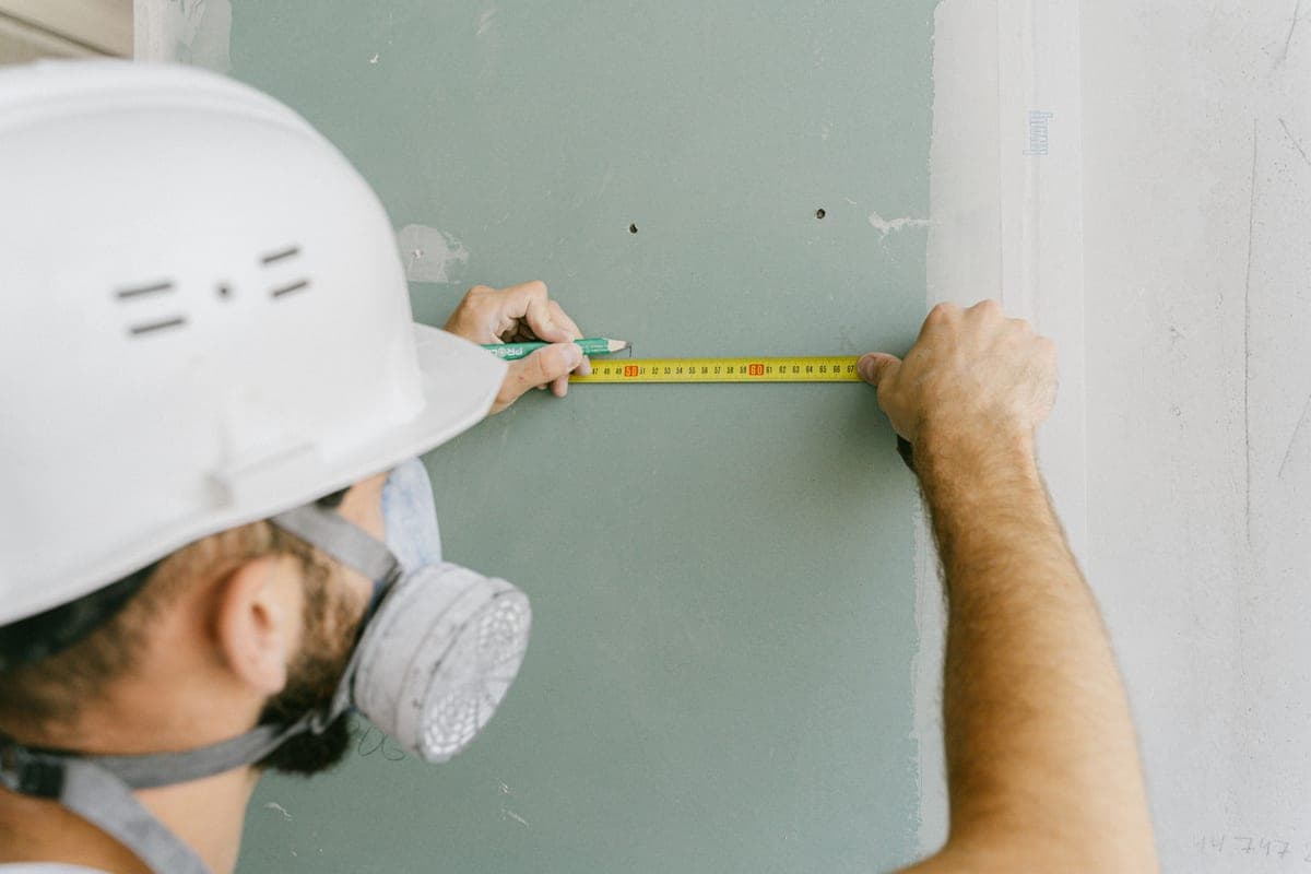Measuring along an exterior wall before planning a light display