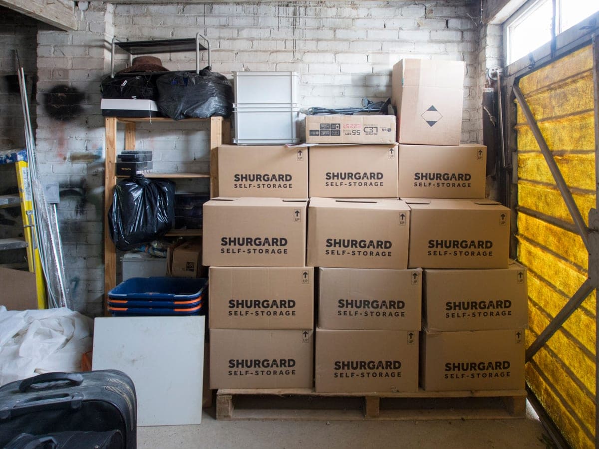 Storage boxes stacked in a garage for seasonal decorations